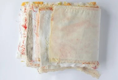 A textile artist book titled Hold Hands Spring Tide by Megan Kennedy on a white background.  This Book won the Tertiary Libris Award for 2025 and describes the observations and mental health struggles and experiences of the artist.  
