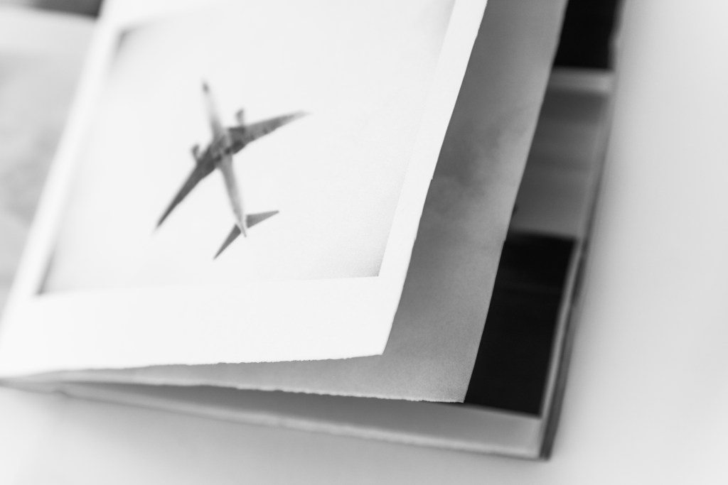 a photograph of a page from a black and white photography zine by artist Megan Kennedy of Aviation and plane spotting